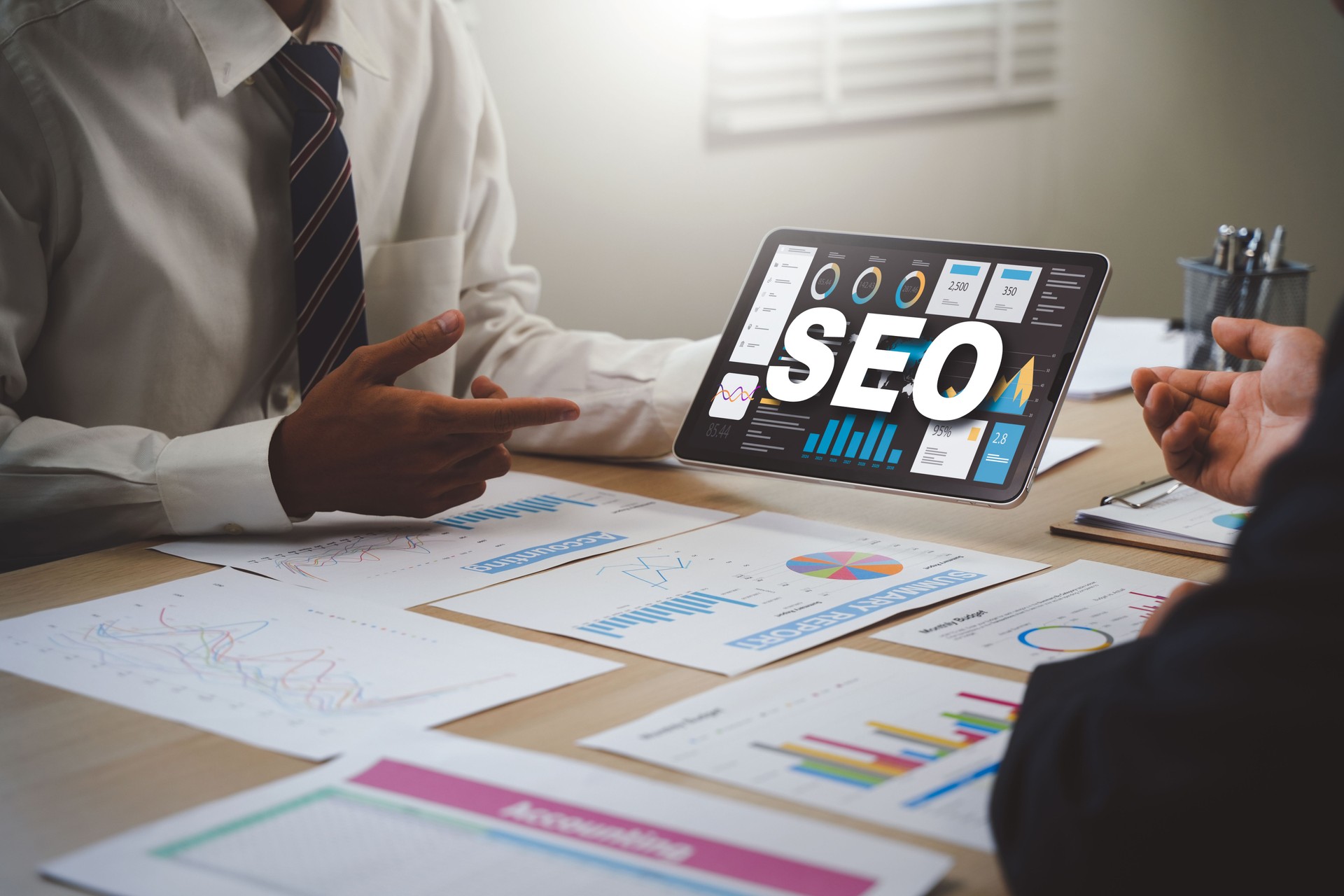 Businessman using computer to analyze SEO, search engine optimization, marketing, traffic ranking, website, internet, business, technology, concept.